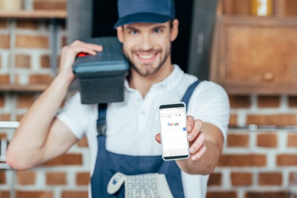 Business owner showing google on phone