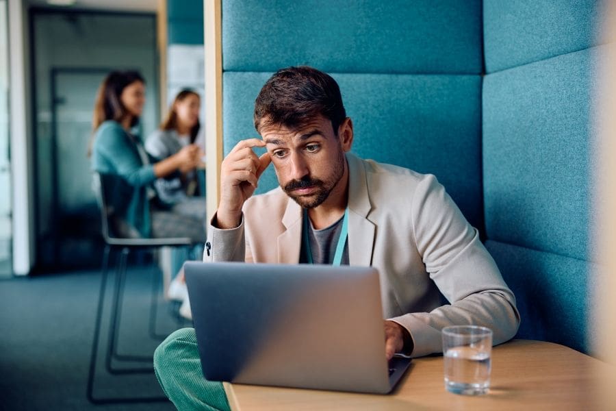 Thoughtful businessman checking his email